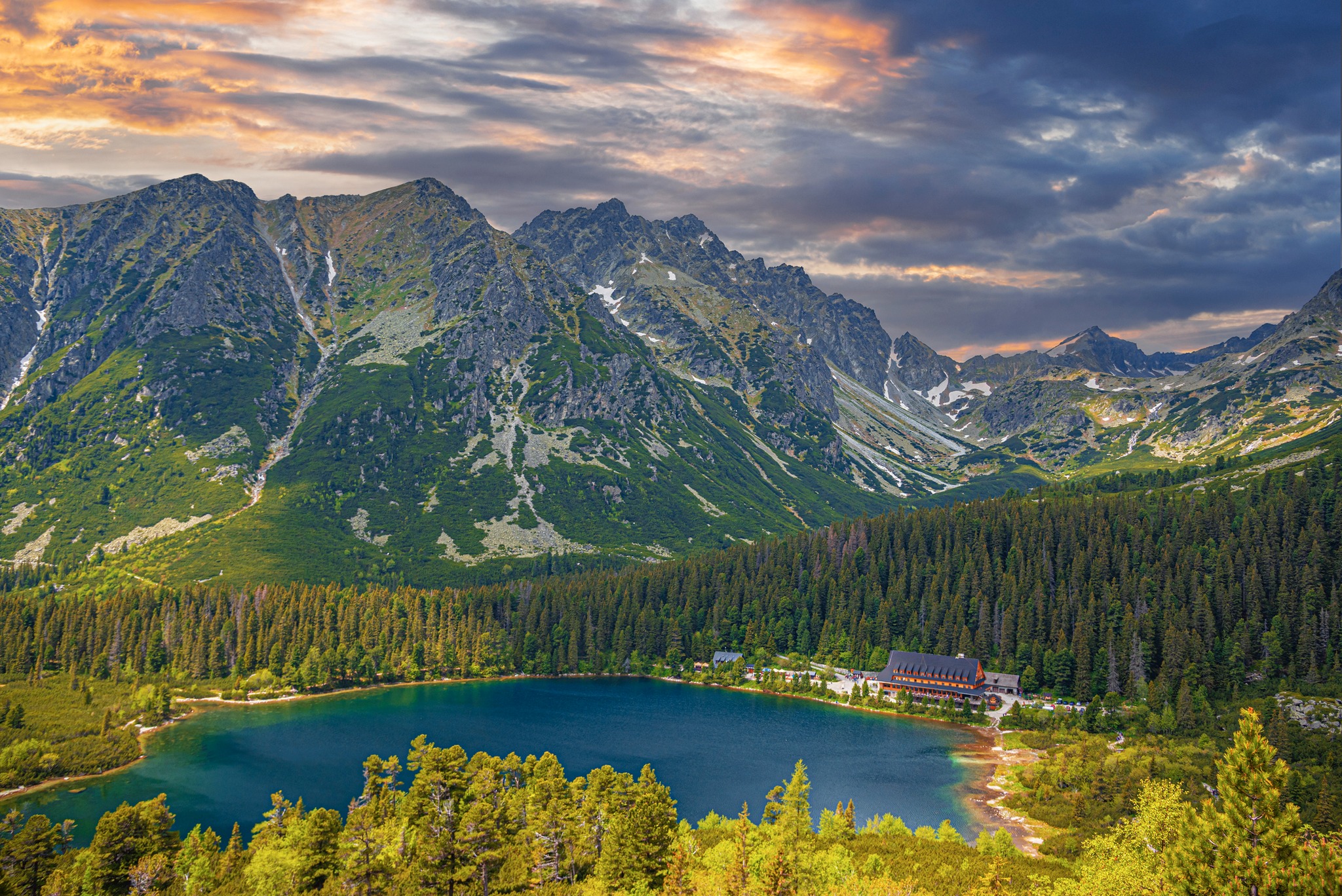 Picturesque panoramic view of Popradske Pleso, Tatra mountains, Slovakia. Lake Popradske pleso with mountain hotel in High Tatras.